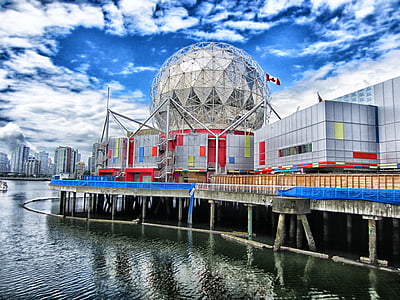 gray concrete building near body of water thumbnail