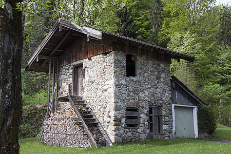 grey concrete house surrounded by green trees during daytime thumbnail