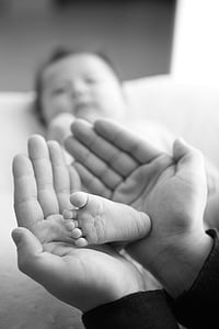 person holding baby's foot thumbnail