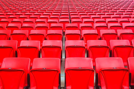 empty red plastic bleachers thumbnail