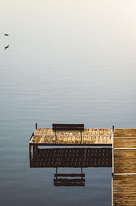 brown dock on body of water thumbnail