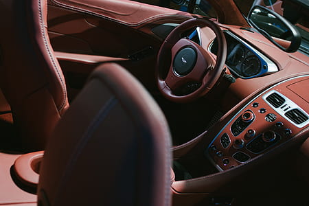 brown and black Aston Martin front interior thumbnail