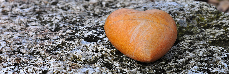 heart-shaped brown stone on floor thumbnail
