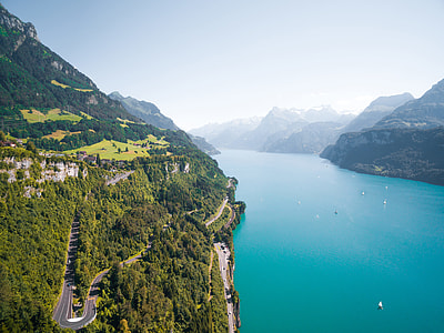 aerial photograph of concrete road on island near river thumbnail