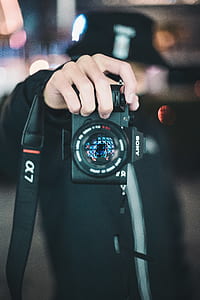person holding camera thumbnail