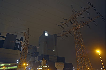 yellow electric pylon under cloudy sky thumbnail