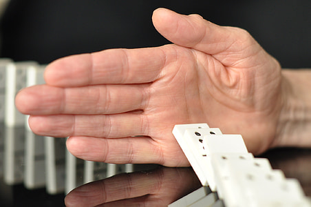 man playing dominoes thumbnail
