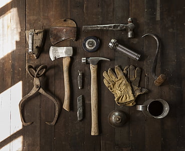 flat lay photography of hand tools on brown wood thumbnail