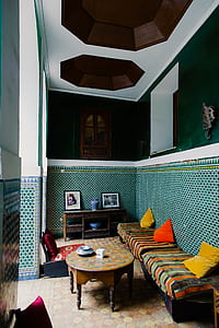 round brown wooden coffee table and bench inside room thumbnail