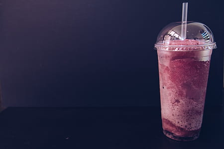 clear plastic cup filled with pink liquid thumbnail