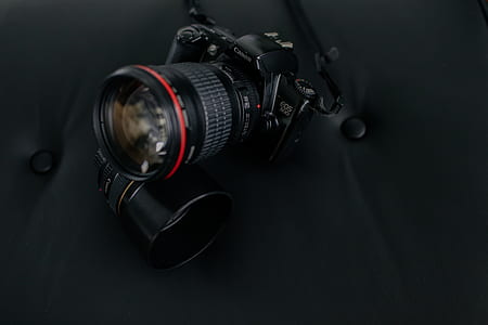 black Canon EOS DSLR camera thumbnail