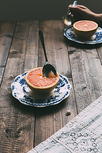 grapefruit on saucer with spoon thumbnail