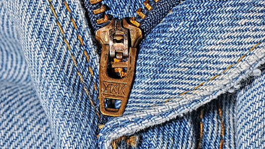 brass zipper and blue denim bottoms thumbnail