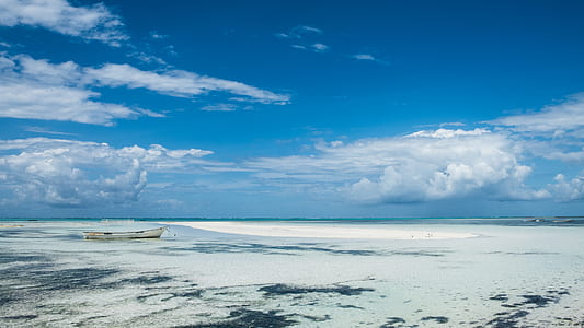 frozen body of water under blue skies thumbnail