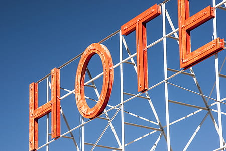 hotel signage under clear sky thumbnail
