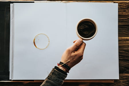 person holding beige ceramic mug thumbnail