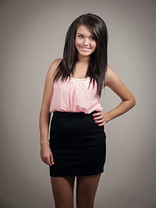 woman wearing pink spaghetti-strap top and black skirt thumbnail