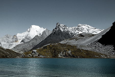 body of water near glacier mountain at daytime thumbnail
