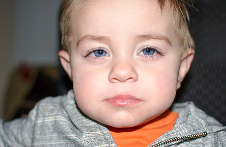 shallow focus photography of a boy thumbnail