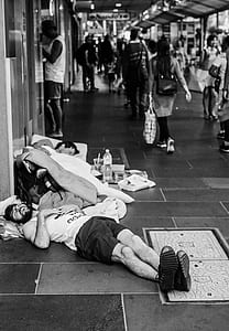 two men sleeping on floor thumbnail
