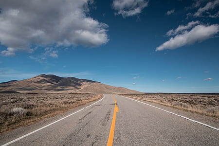 landscape photography of road path and mountain thumbnail