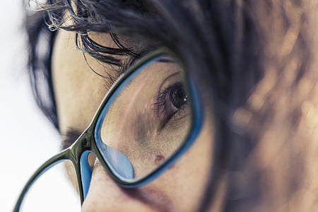 selective focus photo of woman wearing black framed eyeglasses thumbnail