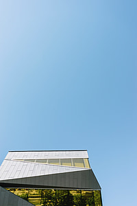 white concrete house under blue sky thumbnail