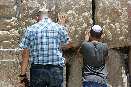 man and boy holding on wall thumbnail