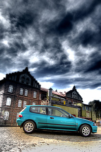 teal 3-door hatchback parked near house thumbnail
