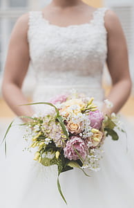 woman in wedding gown holding wedding bouquet thumbnail
