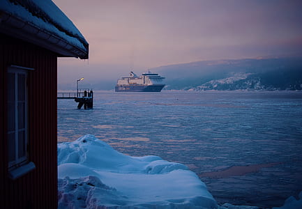 ship on body of water near dock thumbnail