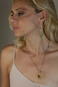 Woman Wearing Necklace, Pair of Earrings and White Spaghetti Strap Top thumbnail