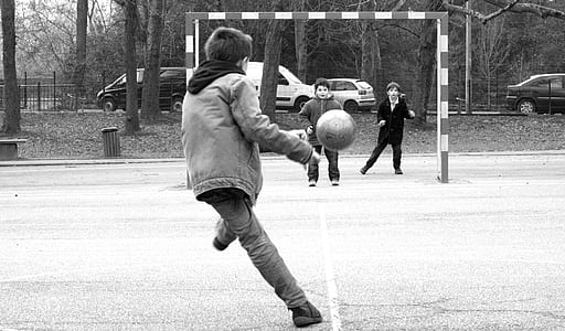 silhouette of boy kicking the ball thumbnail