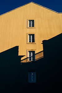 brown concrete house under sunrise thumbnail