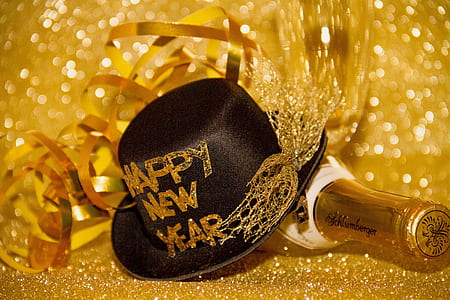black hat over bottle with gold backgrund thumbnail