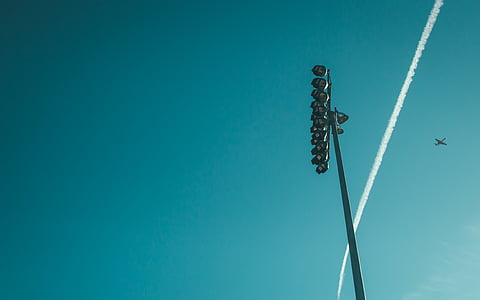 low-angle photography of flying plane at daytime thumbnail