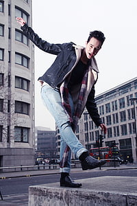 fashion photography of man on gray concrete pavement thumbnail