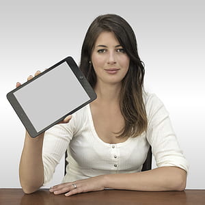 photo of woman holding black tablet computer thumbnail