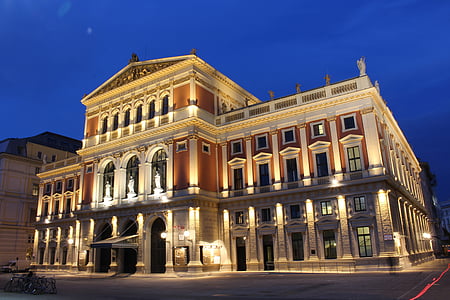 white building under blue sky thumbnail