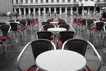 stainless steel tables and chairs on wet floor thumbnail