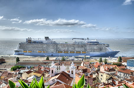blue cruise ship on body of water thumbnail