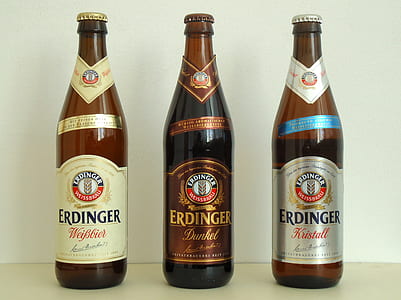 three Erdinger beer bottles on white surface thumbnail