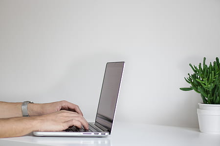 person using gray laptop computer thumbnail