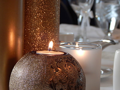 closeup photo of two lit candles thumbnail