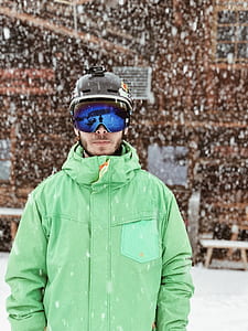 man standing on snow outdoors thumbnail