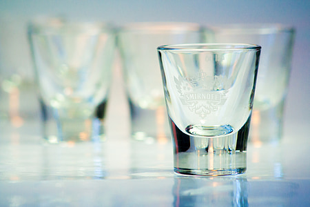 selective focus photography of empty shot glass thumbnail
