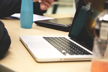 MacBook Pro on brown table thumbnail