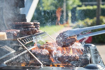person grilling patty thumbnail