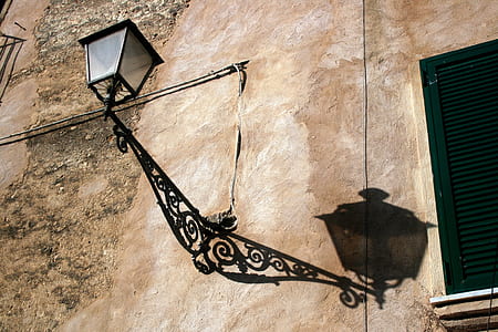 black wall lantern placed on brown wall thumbnail