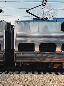 silver train on railroad thumbnail